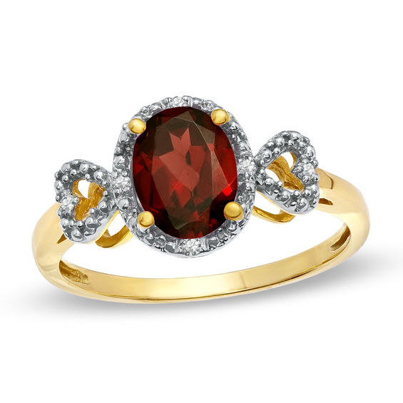 oval garnet and diamond accent ring in 10k gold oval