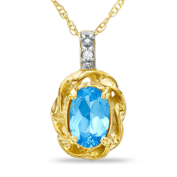 Oval Blue Topaz and Diamond Accent Twist Frame Pendant in 10K Gold Blue Topaz December