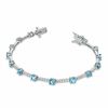 Thumbnail Image 1 of Swiss Blue Topaz and Lab-Created White Sapphire Bracelet in Sterling Silver - 7.25"