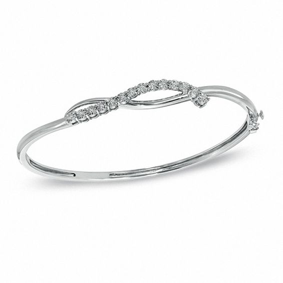1/10 CT. T.W. Diamond Twist Bangle in Sterling Silver Bangles and Cuffs Bracelets Zales