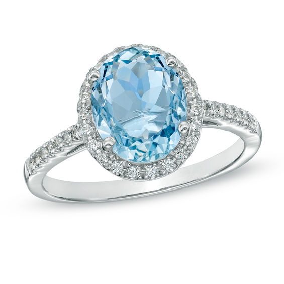 Oval Aquamarine and 1/5 CT. T.W. Diamond Frame Engagement Ring in 