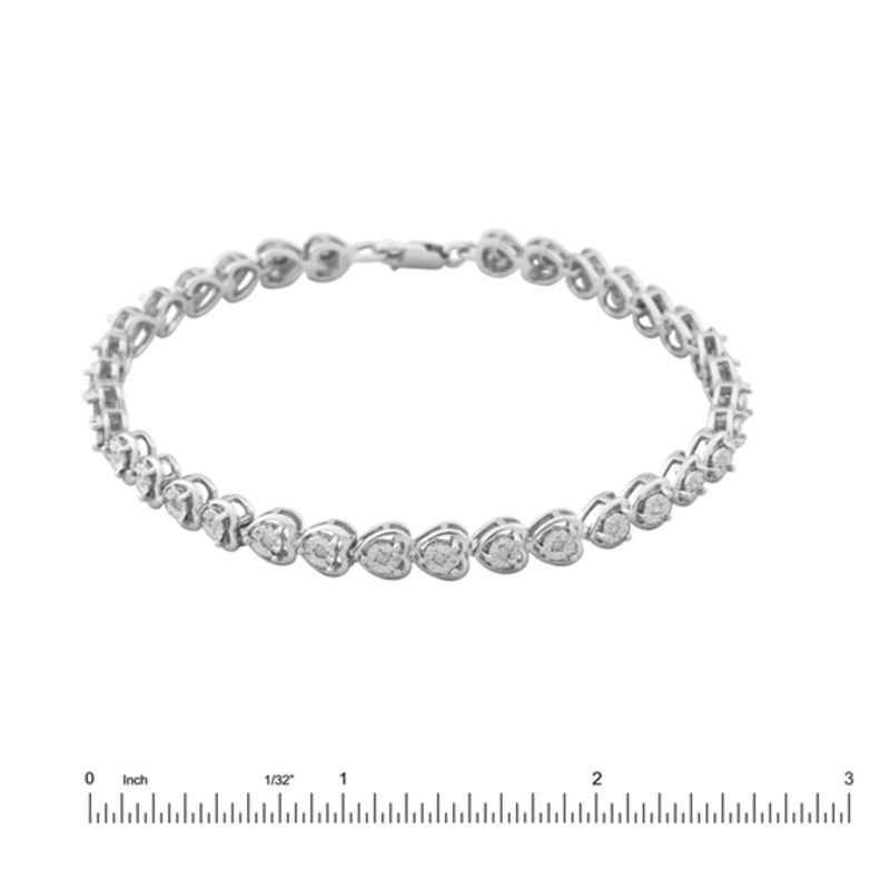 1/6 CT. T.W. Diamond Heart Line Bracelet in Sterling Silver 7.25