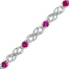 Thumbnail Image 0 of Lab-Created Ruby and 1/20 CT. T.W. Diamond Infinity Bracelet in Sterling Silver - 7.5"