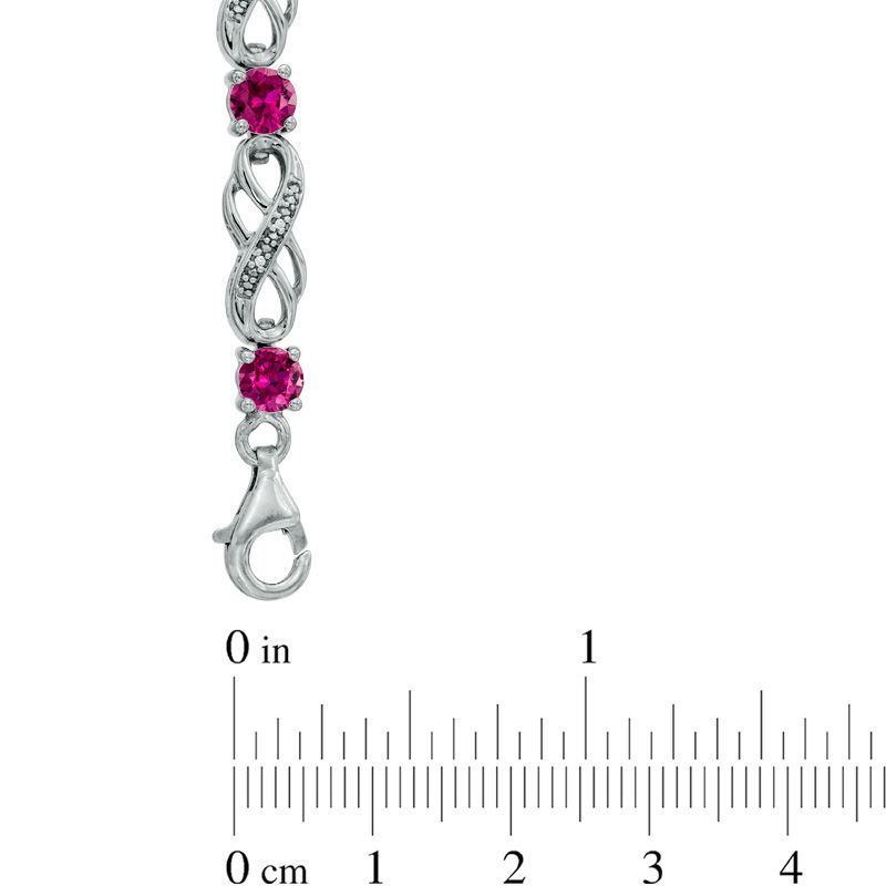 Lab-Created Ruby and 1/20 CT. T.W. Diamond Infinity Bracelet in Sterling Silver - 7.5"