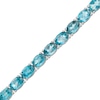 Thumbnail Image 0 of Oval Blue Topaz Tennis Bracelet in Sterling Silver