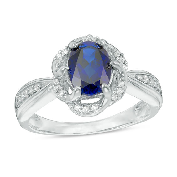 Oval LabCreated Blue Sapphire and 1/10 CT. T.W. Diamond Frame Ring in