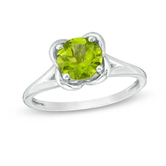 Silver Sterling Green Olivine Ring Holding Peridot Gems And Finished With Rhodium.