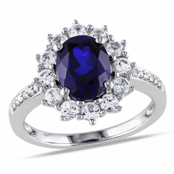 oval lab created blue and white sapphire sunburst frame ring in