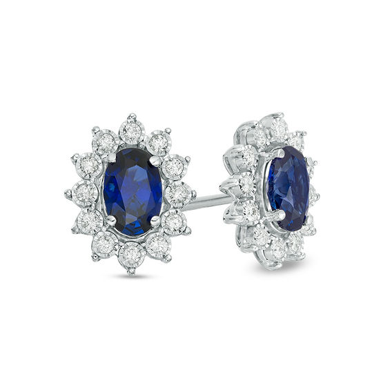 Oval Lab-Created Blue Sapphire and 1/6 CT. T.W. Diamond Starburst Frame  Stud Earrings in 10K White Gold