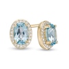 Thumbnail Image 0 of Oval Blue Topaz and 1/10 CT. T.W. Diamond Frame Stud Earrings in 10K Gold