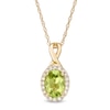 Thumbnail Image 0 of Oval Peridot and 1/15 CT. T.W. Diamond Frame Pendant in 10K Gold