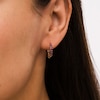 Thumbnail Image 1 of Ruby and White Sapphire Reversible Huggie Hoop Earrings in 10K Gold