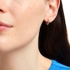 Thumbnail Image 1 of Lab-Created Emerald Huggie Hoop Earrings in 10K Gold