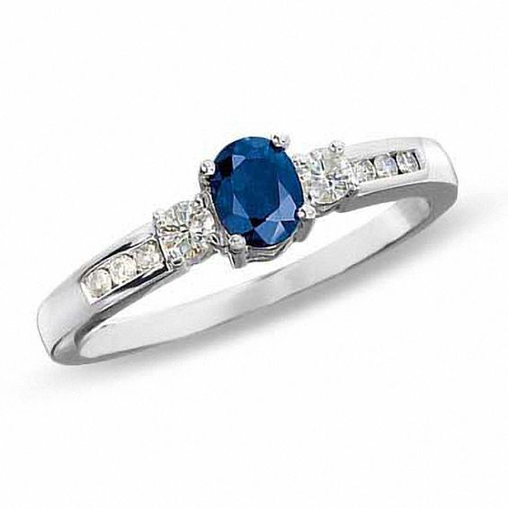 Blue Sapphire and 1/7 CT. T.w. Diamond Three Stone Ring in 10K White Gold