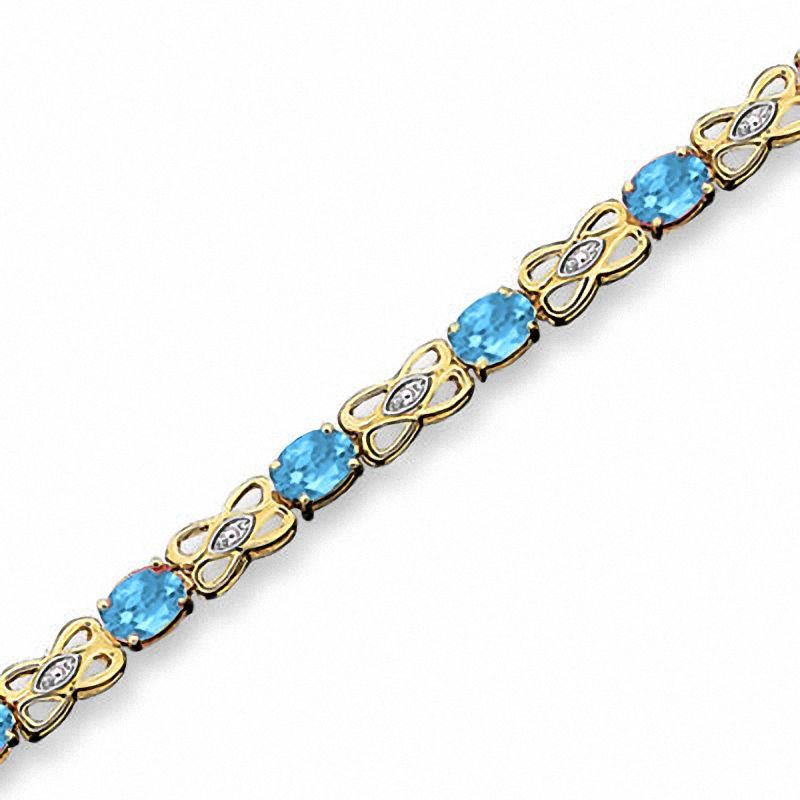 Main Image 1 of Oval Blue Topaz Fashion Bracelet in 10K Gold with Diamond Accents