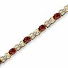 Thumbnail Image 1 of Oval Garnet Fashion Bracelet in 10K Gold with Diamond Accents