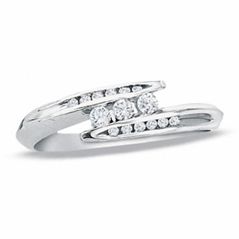 1/5 CT. T.W. Diamond Three Stone Bypass Ring in 10K White Gold