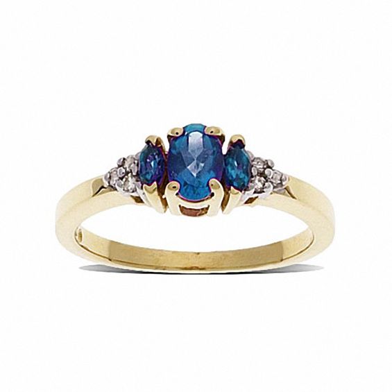 Blue Topaz Three Stone Ring in 10K Gold with Diamond Accents
