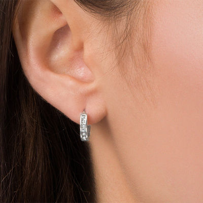 1/10 CT. T.W. Diamond Huggie Hoop Earrings in 10K White Gold | Zales