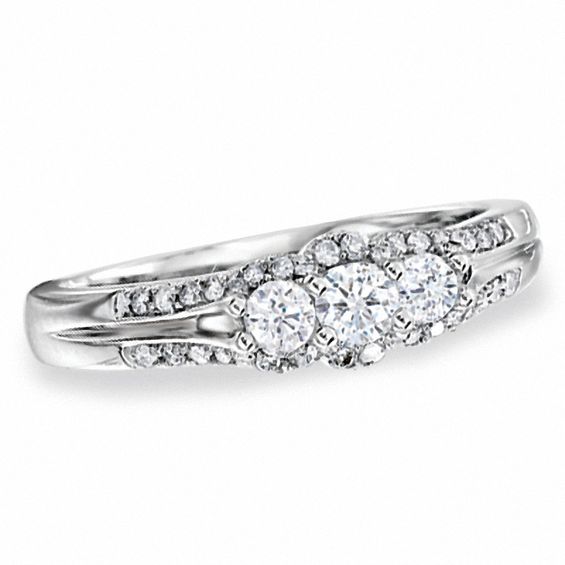 1/2 CT. T.w. Diamond PavÃ© Three Stone Framed Ring in 10K White Gold