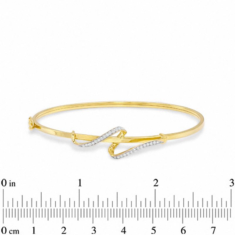 Main Image 2 of 1/5 CT. T.W. Diamond Swirl Bangle in 10K Gold