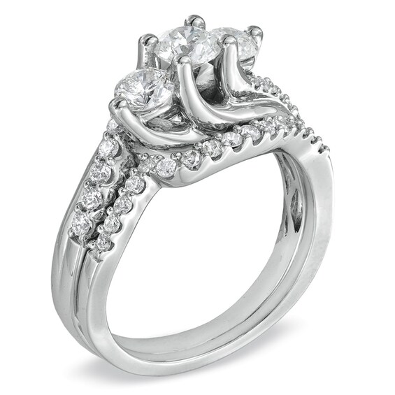 1-1/4 CT. T.w. Diamond Three Stone Bridal Set in 14K White Gold