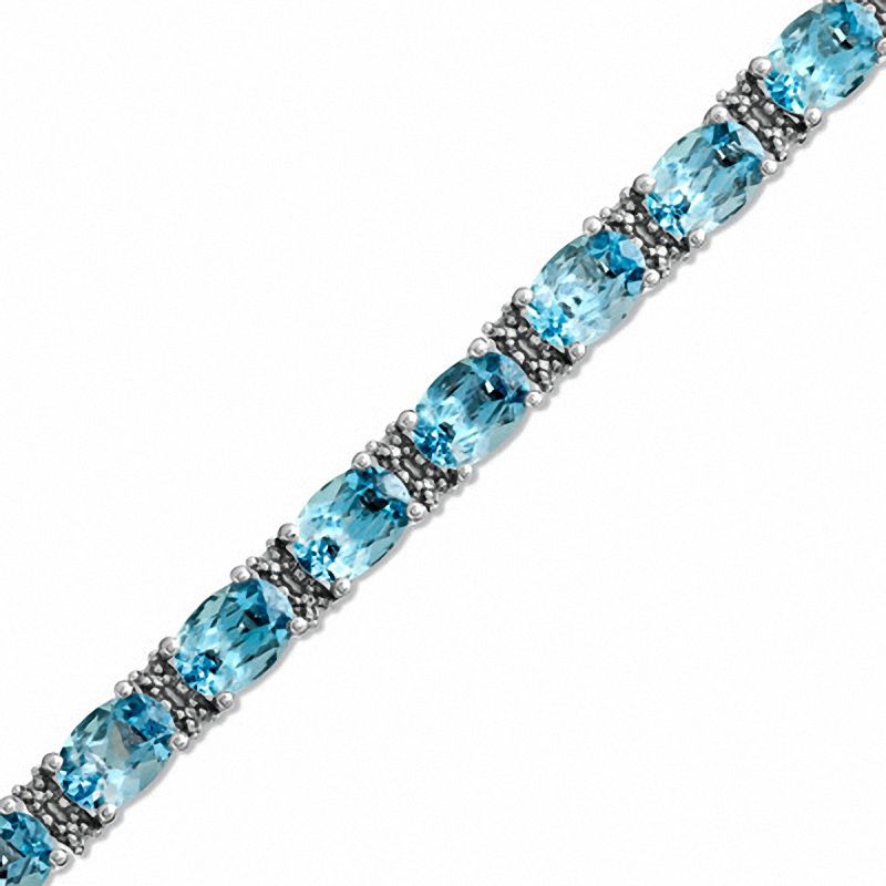 Main Image 1 of Oval Blue Topaz and Diamond Accent Line Bracelet in Sterling Silver - 7.25"