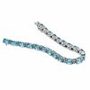 Thumbnail Image 2 of Oval Blue Topaz and Diamond Accent Line Bracelet in Sterling Silver - 7.25"