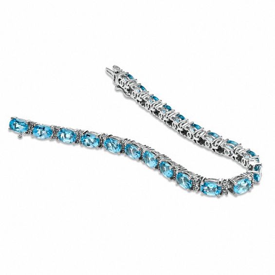 Oval Blue Topaz and Diamond Accent Line Bracelet in Sterling Silver - 7.25"