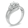 1 CT. T.W. Round and Baguette Diamond Three Stone Swirl Engagement Ring in 14K White Gold