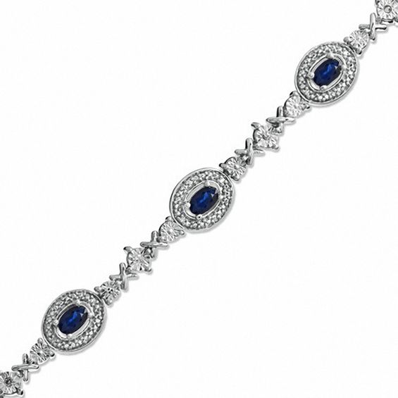 Oval Blue Sapphire and 1/10 CT. T.w. Diamond Bracelet in Sterling Silver