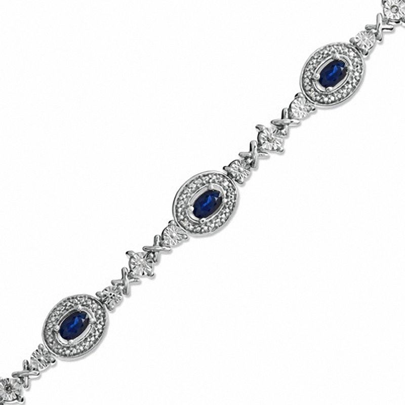 Main Image 1 of Oval Blue Sapphire and 1/10 CT. T.W. Diamond Bracelet in Sterling Silver