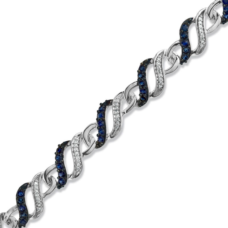 Main Image 1 of Blue Sapphire and 1/3 CT. T.W. Diamond Swirl Bracelet in Sterling Silver