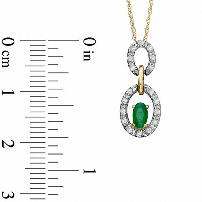Oval Emerald and 1/8 CT. T.W. Diamond Double Circle Frame Pendant in 10K Gold