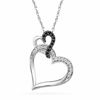 Thumbnail Image 1 of 1/15 CT. TW. Enhanced Black and White Diamond Tilted Double Heart Pendant in Sterling Silver