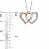 Thumbnail Image 2 of 1/8 CT. T.W. Diamond Double Heart Pendant in 10K Two-Tone Gold
