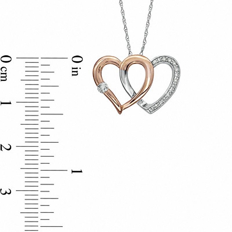 Main Image 2 of 1/8 CT. T.W. Diamond Double Heart Pendant in 10K Two-Tone Gold