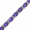 Thumbnail Image 1 of Oval Amethyst and Diamond Accent Bracelet in Sterling Silver - 7.25"