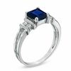 Thumbnail Image 1 of Emerald-Cut Blue Sapphire and 1/10 CT. T.W. Diamond Engagement Ring in 14K White Gold