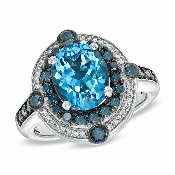 Oval Blue Topaz and 3/4 CT. T.w. Enhanced Blue and White Diamond Ring in Sterling Silver