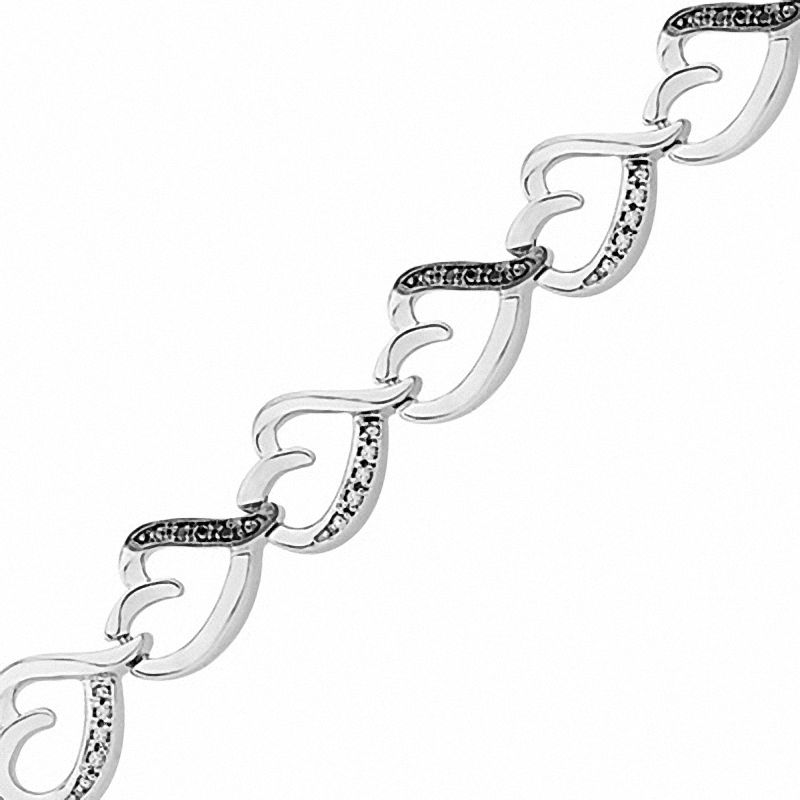 1/8 CT. T.W. Enhanced Black and White Diamond Tilted Heart Link Bracelet in Sterling Silver