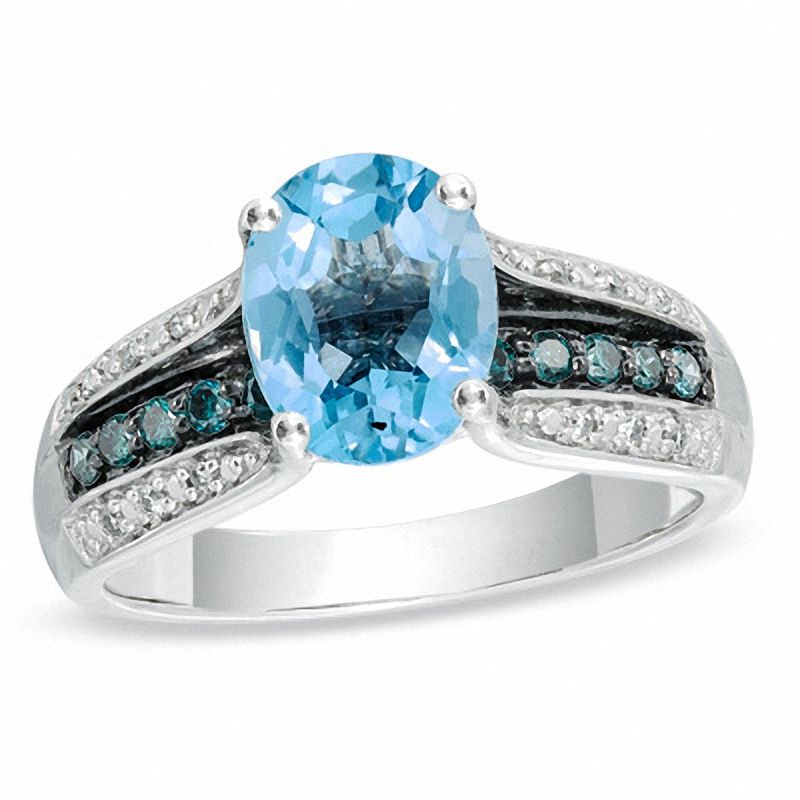 Main Image 1 of Oval Swiss Blue Topaz and 1/4 CT. T.W. Enhanced Blue and White Diamond Ring in 10K White Gold