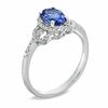 Thumbnail Image 1 of Oval Tanzanite and 1/6 CT. T.W. Diamond Buckle Ring in 10K White Gold