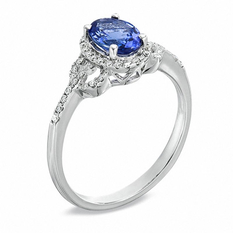 Oval Tanzanite and 1/6 CT. T.W. Diamond Buckle Ring in 10K White Gold