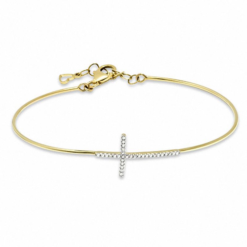 1/6 CT. T.W. Diamond Sideways Cross Bangle in 10K Gold - 7.5"