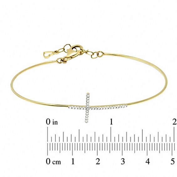 1/6 CT. T.w. Diamond Sideways Cross Bangle in 10K Gold - 7.5"