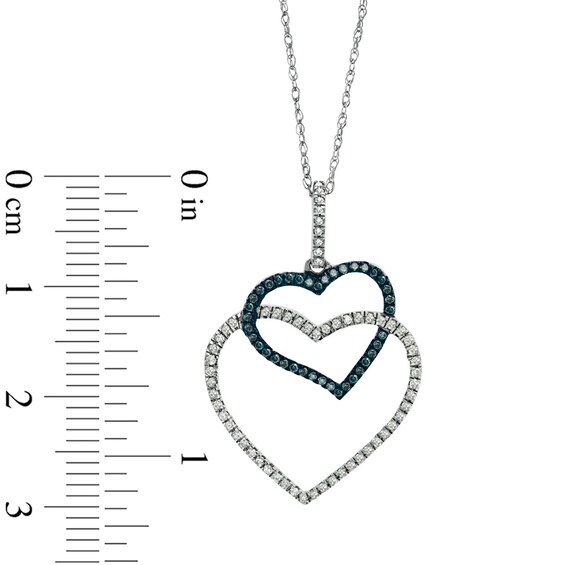 1/4 CT. T.w. Enhanced Blue and White Diamond Double Heart Pendant in 10K White Gold