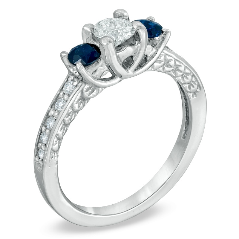 1/2 CT. T.W. Diamond and Blue Sapphire Three Stone Engagement Ring in 14K White Gold