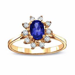 Oval Blue Sapphire and 1/8 CT. T.W. Diamond Engagement Ring in 14K Gold
