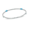 Thumbnail Image 1 of Oval Swiss Blue Topaz and Lab-Created White Sapphire Bangle in Sterling Silver - 8.0"